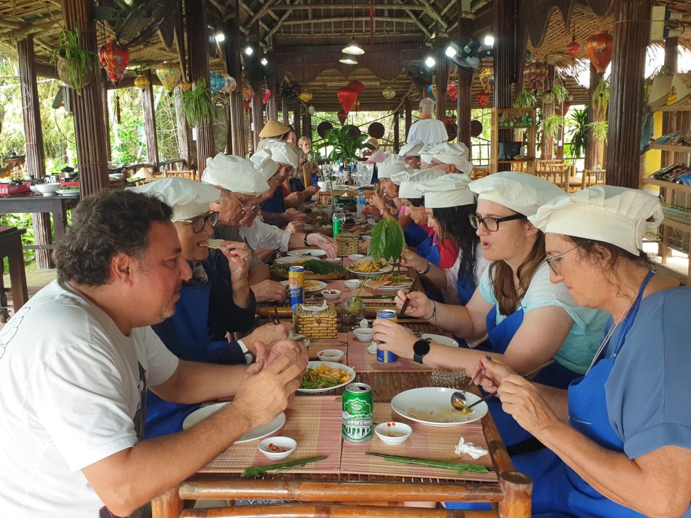 Enjoy meal at Experience Tra Que Cooking Class in Tra Que Vegetable Village © 2024 V-Explorer® All rights reserved.