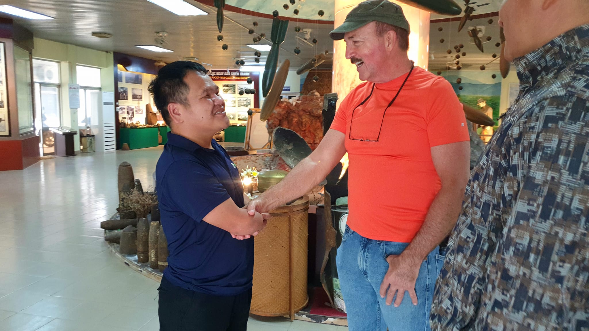 The warm handshake and friendly smile of the American veteran for the landmine victim working at the Mine Action Visitor Center © 2024 V-Explorer® All rights reserved. The warm handshake and friendly smile of the American veteran for the landmine victim working at the Mine Action Visitor Center © 2024 V-Explorer® All rights reserved.